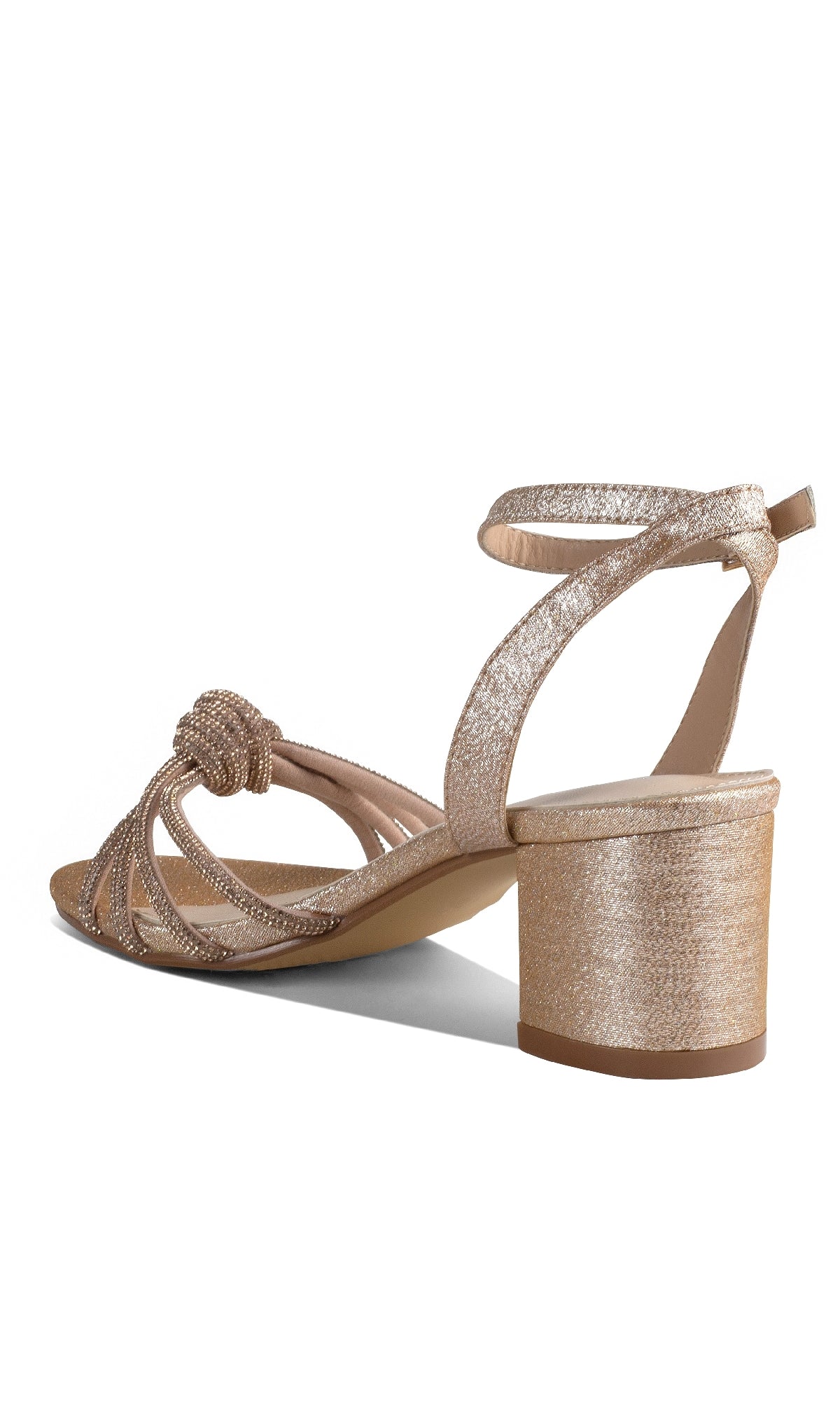 The Libra Champagne Glitter Prom Shoes: Touch Ups 4652 feature a gold glitter finish, open toe, ankle strap, knot detail, and low block heel—ideal for adding an elegant touch to your prom look.